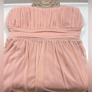 Long pink strapless bridesmaids dress with beaded neck line attachment